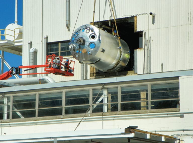 Stainless steel welded process piping and reactor installation showing industrial piping solutions at a chemical plant