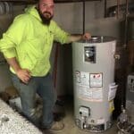 Wilkes plumber beside a newly installed residential water heater