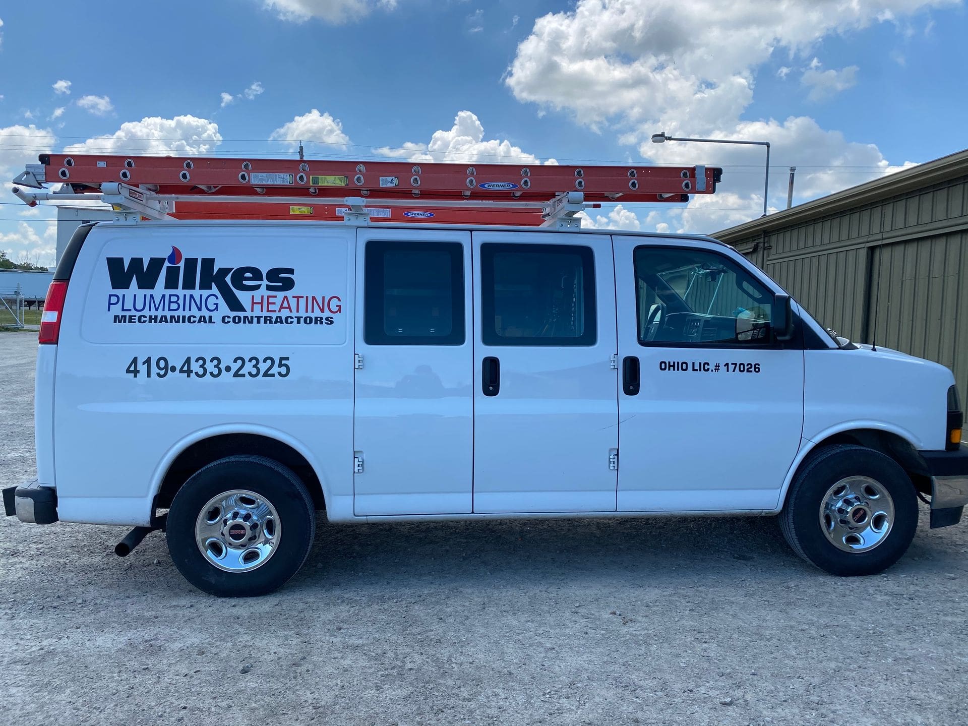 Wilkes Plumbing & Heating service van with a roof ladder rack