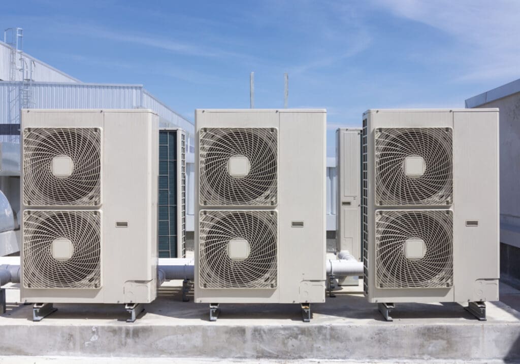 Technician performing commercial HVAC repair on a rooftop unit at an Ohio facility