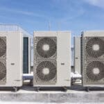 Technician performing commercial HVAC repair on a rooftop unit at an Ohio facility