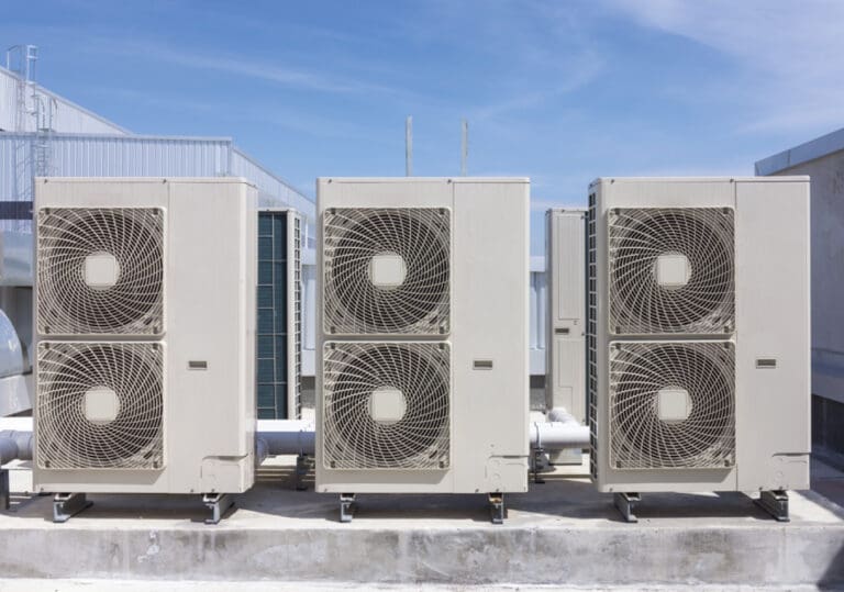 Technician performing commercial HVAC repair on a rooftop unit at an Ohio facility
