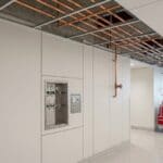Medical gas zone valve box and copper lines in a hospital corridor