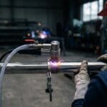 Orbital welding head on a polished stainless steel high-purity tube