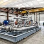 Prefabricated process piping skid assembled in a fabrication shop